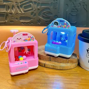 Porte-clés mini machine à pince lumineuse avec balles colorées en rose et bleu