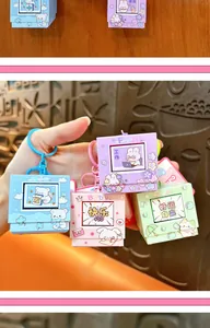 Close-up of colorful cartoon fidget toy keychains with light and sound features.