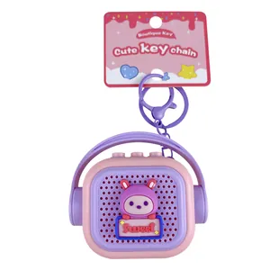 Cute pink and purple mini speaker shaped keychain toy with a cartoon rabbit design