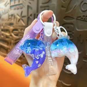 Cute liquid quicksand dolphin keychain with floating sequins and wrist strap charms