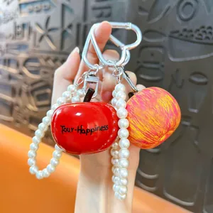 Creative resin apple keychain with pearl beads and heart-shaped clip