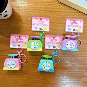Creatieve kleurrijke mini-weegschaal sleutelhangers met licht en geluid voor rust.