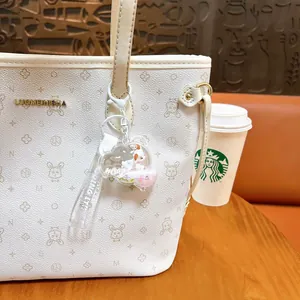Exquisite creative liquid quicksand keychain with cute sheep on white patterned bag