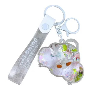 Creative oil-filled sheep keychain with liquid quicksand and glittery strap charm.