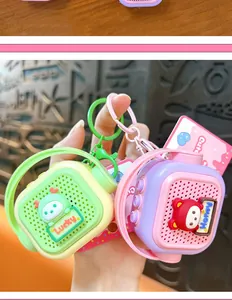 Detailed view of two cute mini speaker keychains with recording function in green and purple
