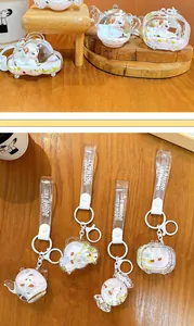 Close-up detail of cute liquid quicksand sheep keychains in teapot and cloud shapes