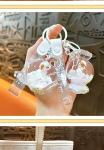 Close-up of creative liquid sheep keychain with glitter filling and durable PVC strap.