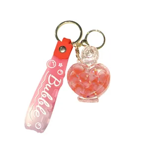 Creative heart perfume bottle keychain with pink liquid quicksand and Bubble strap.