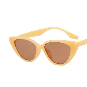 Vintage beige cat-eye sunglasses with brown lenses for a stylish retro look