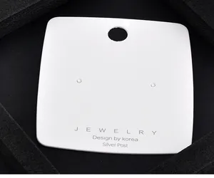 Close-up detail of white jewelry packaging card featuring pre-punched holes and Silver Post text