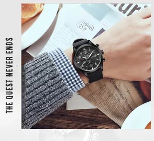 Close-up of Ochstin men's black chronograph watch with nylon strap on a wrist