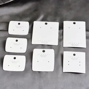 Premium set of six white jewelry display cards for earrings on elegant grey silk