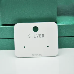 Elegant white earring display card with 'SILVER 925' text print for jewelry packaging.