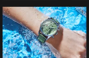 Close-up of OCHSTIN men's waterproof quartz watch with green nylon strap in water