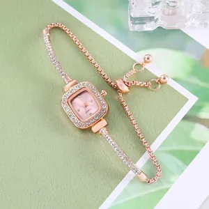 Elegant rose gold square rhinestone bracelet watch featuring an adjustable drawstring closure.