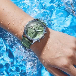 Men's OCHSTIN waterproof quartz watch with green dial and green nylon strap in splashing water