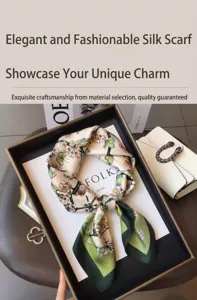 Butterfly and floral print silk square scarf detail shot in a luxury lifestyle setting