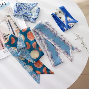 Detailed view of four retro floral skinny silk scarves for hair styling