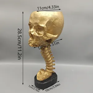 Detailed measurements of a golden skull planter with a unique spine stand design