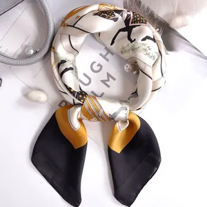 Elegant silk square scarf with classic horse motif and black contrast border in detail