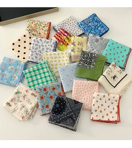 Assorted cotton linen square scarves with vibrant floral and various geometric patterns
