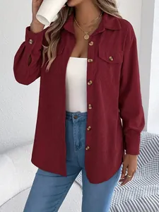 Close-up detail of a women's burgundy corduroy long sleeve shirt jacket with buttons