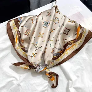 Elegant square silk-like scarf featuring a luxury vintage floral and feather pattern.