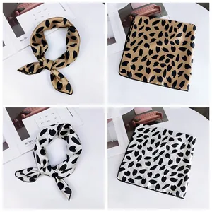Set of two stylish patterned women's neck scarves in khaki and white with leaf prints