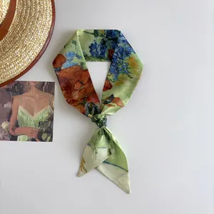 Macro view of a skinny silk scarf featuring Van Gogh oil painting style in green
