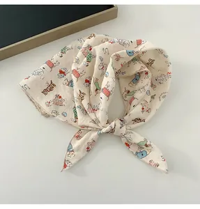 Close-up of a soft cotton linen square scarf featuring a playful cartoon dog print