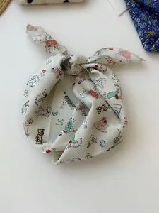 Detail of cotton linen square scarf featuring cute dog pattern illustrations