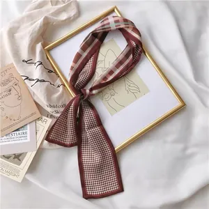 Detail of a retro French style silk ribbon with plaid and houndstooth patterns