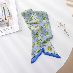 Close-up of French vintage blue floral skinny scarf made of light chiffon material