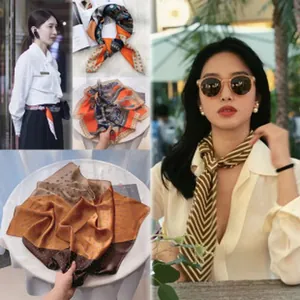Detailed view of vintage French style skinny scarves with various elegant patterns