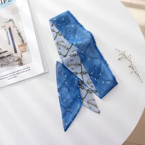 Close-up of blue French vintage nautical anchor pattern long silk scarf hair ribbon