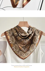 Close-up view of elegant brown paisley silk-like scarf draped on a white shirt detail