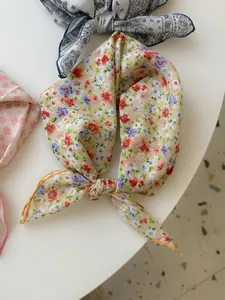 Detailed view of a soft floral cotton linen neck scarf with vintage aesthetic pattern