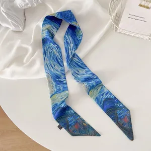 Detailed view of the Van Gogh Starry Night print on this narrow silk scarf hair band