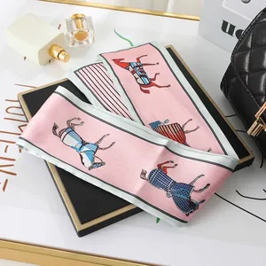 Detailed view of pink French silk scarf with vintage equestrian horse print pattern