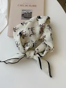 Macro view showing the soft texture and retro horse pattern of a cotton linen neckerchief
