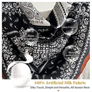 Elegant black and white paisley faux silk square scarf, perfect for neck or hair styling.