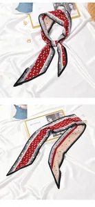 Elegant detail view of a red and cream pleated polka dot skinny scarf hair ribbon