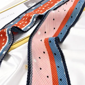 Elegant pleated skinny silk scarf featuring colorful stripes and polka dot patterns