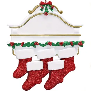 Detailed view of a white Christmas ornament with red glitter stockings and holly.