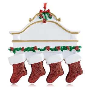 Detail showing a festive white acrylic plaque ornament with four red glitter stockings