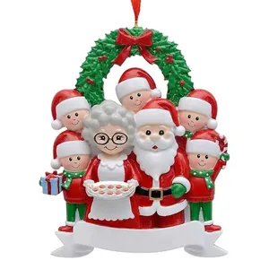 Personalized Christmas family ornament featuring Santa and elves for tree decoration