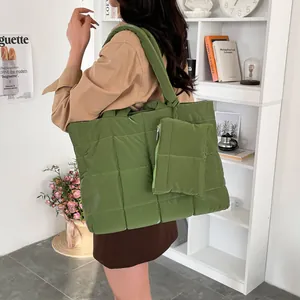 Stylish large green quilted puffer tote bag with small zipper pouch for women commuting