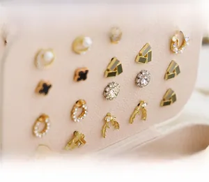 Detailed macro view of jewelry box interior featuring earring storage studs and soft lining