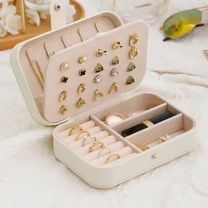 Portable double-layer jewelry box showing ring slots and earring board storage