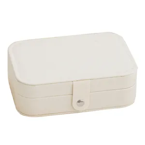 Portable double-layer jewelry storage box in cream textured canvas with button snap